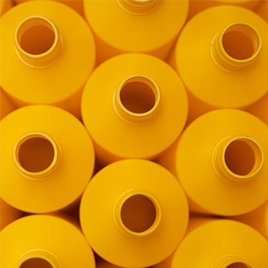 Top down view of empty yellow bottles | Cedesa